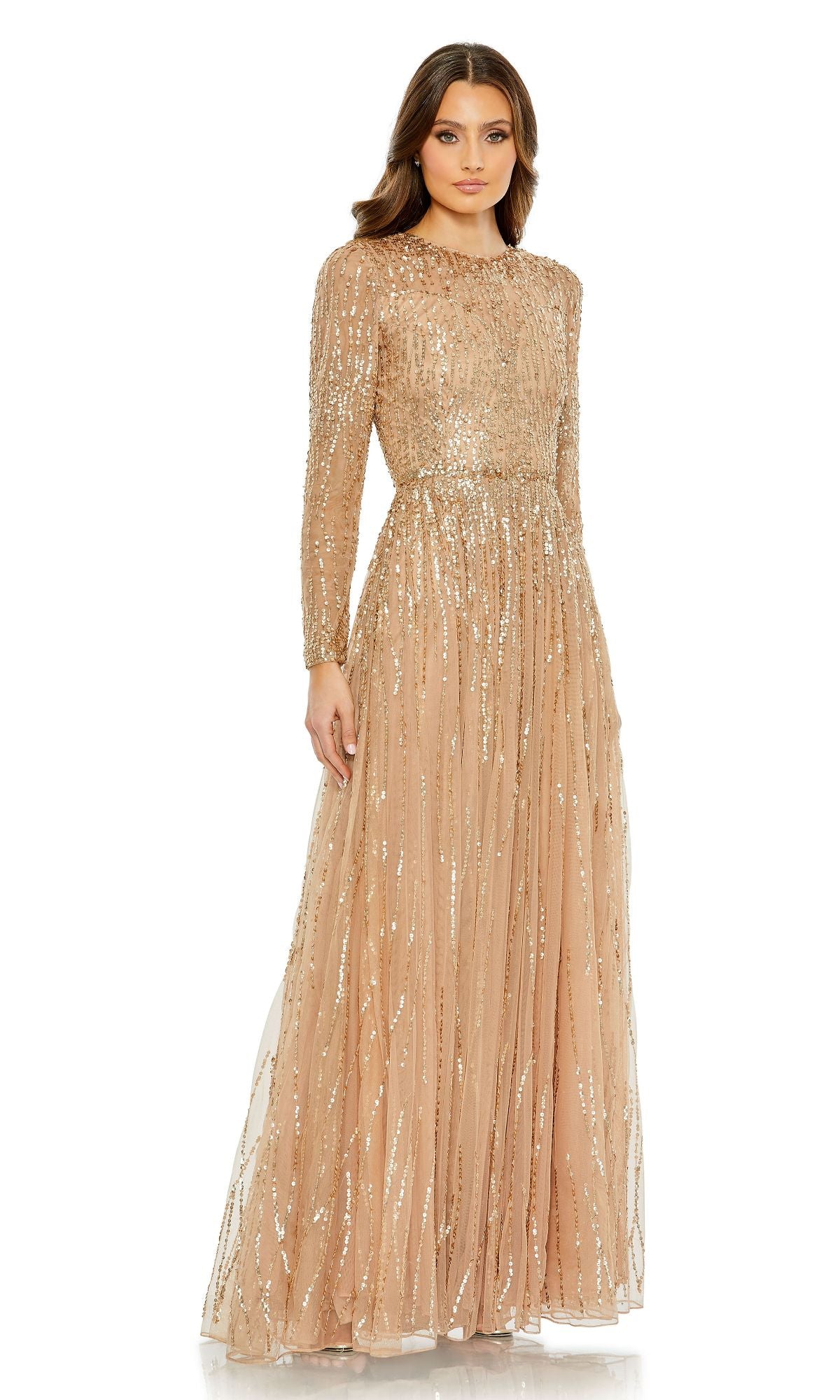 A woman wears the Modest Long Sleeve Formal Dress: Mac Duggal 5636 in nude with gold sequins, featuring elegant beading and long sleeves for a timeless, sophisticated evening look against a white background.